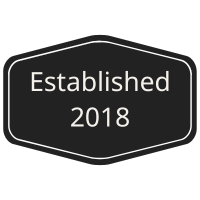 Black sign reading Established 2018.